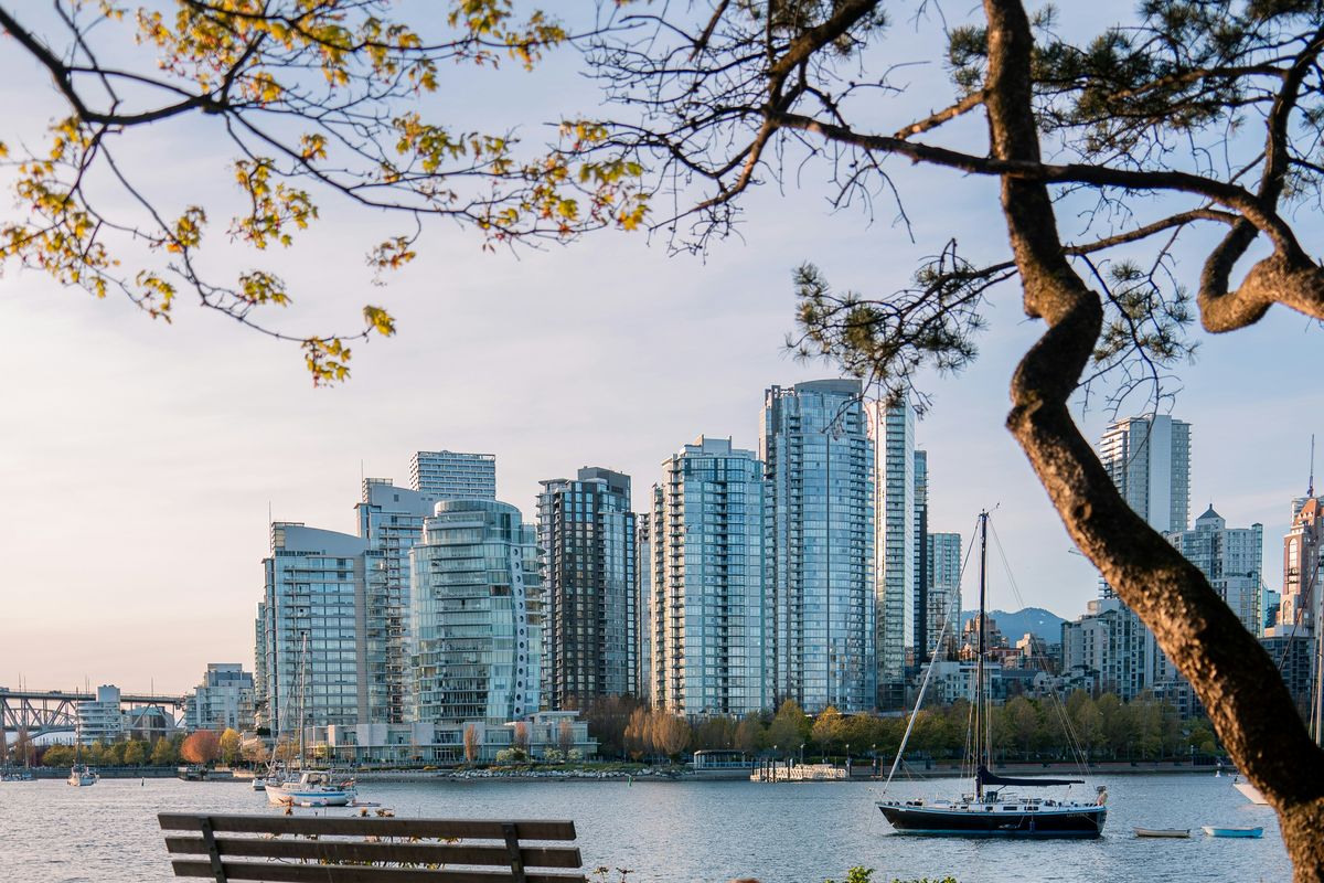 Park bench overlooking Vancouver skyline and sailboats on False Creek