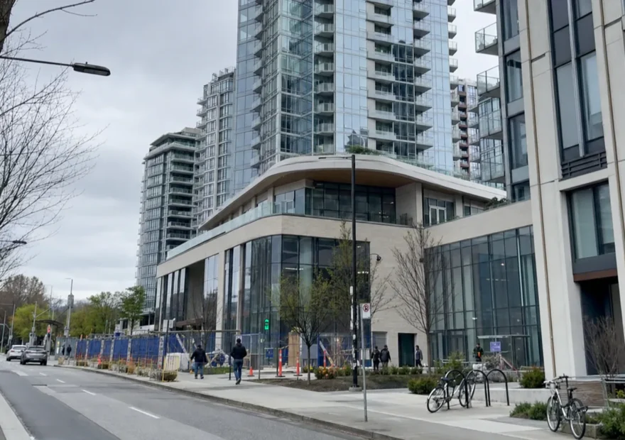 Street-level view of a modern Oakridge-area development in Vancouver
