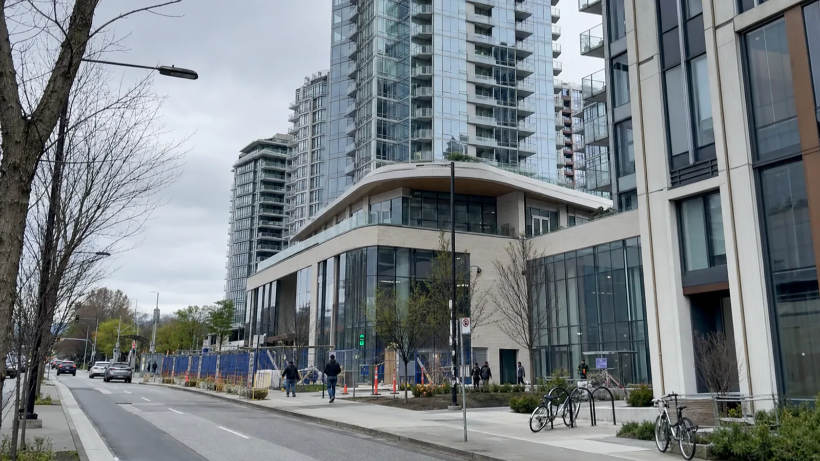 Street-level view of a modern Oakridge-area development in Vancouver